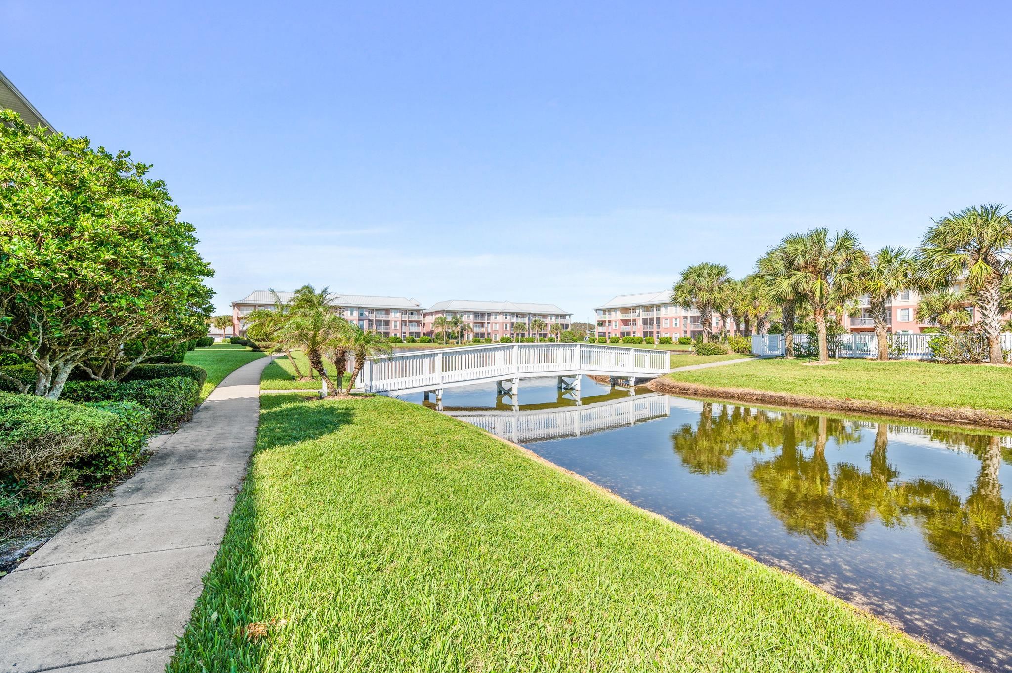 285 Atlantis Circle, Unit 203 St. Augustine, FL 32080 - Photo 51 of 71 a view of swimming pool with outdoor seating and lake view