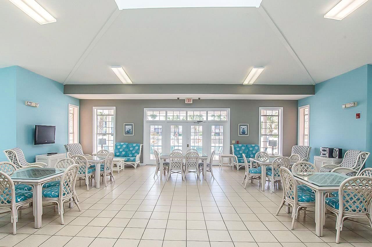 285 Atlantis Circle, Unit 203 St. Augustine, FL 32080 - Photo 58 of 71 a view of a dining room with furniture window and outside view