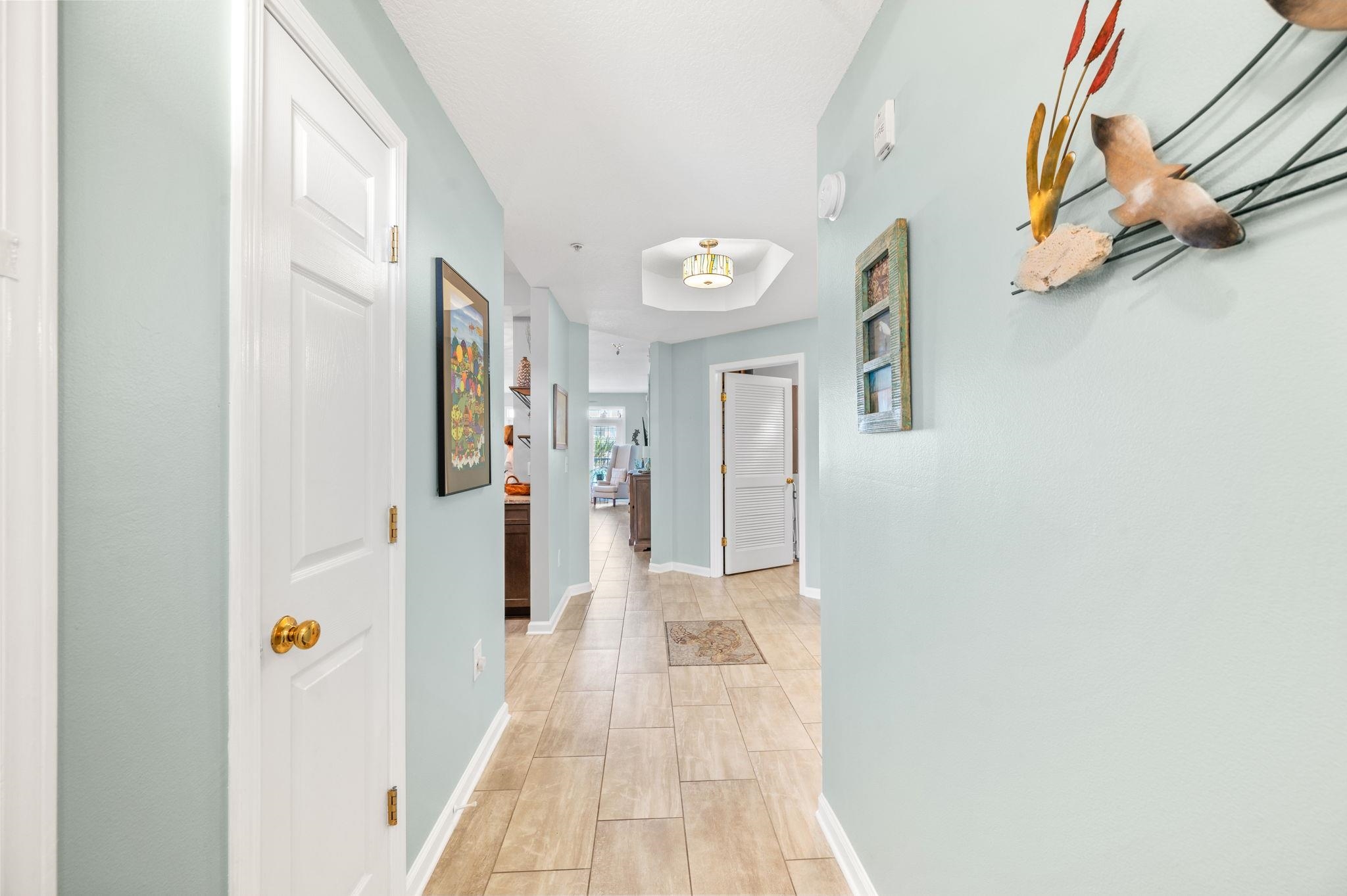 285 Atlantis Circle, Unit 203 St. Augustine, FL 32080 - Photo 6 of 71 a view of a hallway with wooden floor and staircase