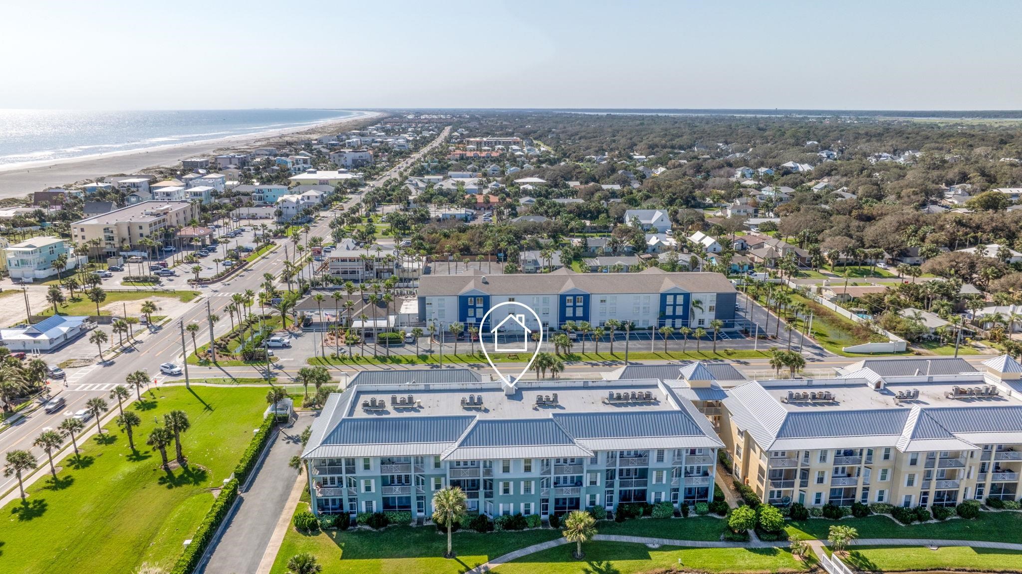 285 Atlantis Circle, Unit 203 St. Augustine, FL 32080 - Photo 69 of 71 an aerial view of residential houses with yard and swimming pool