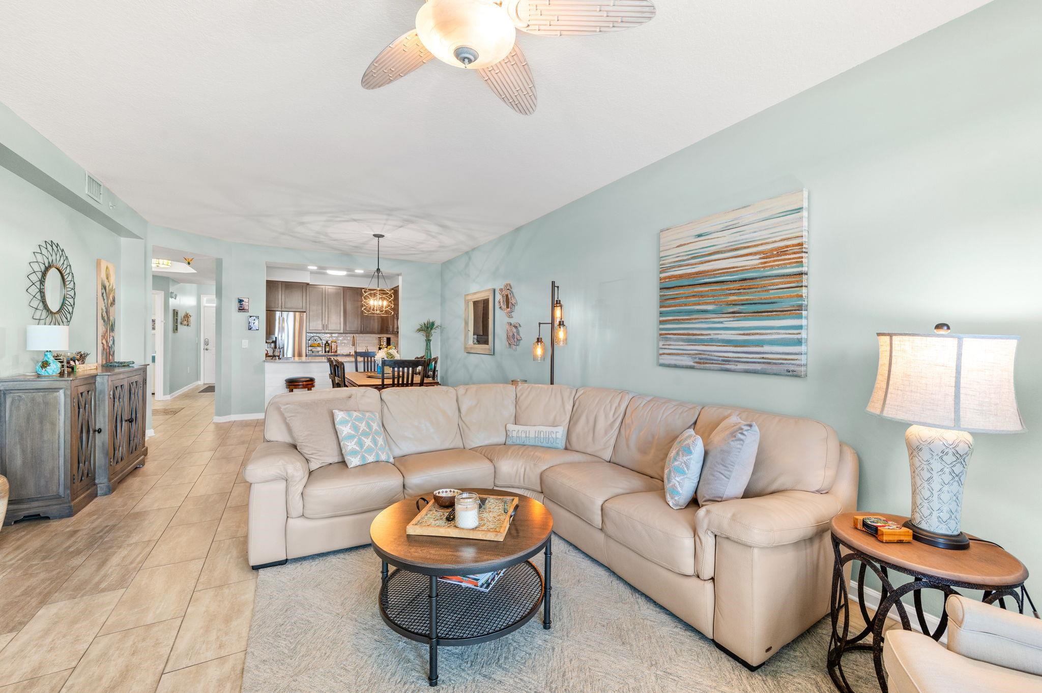 285 Atlantis Circle, Unit 203 St. Augustine, FL 32080 - Photo 10 of 71 a living room with furniture a rug and a lamp