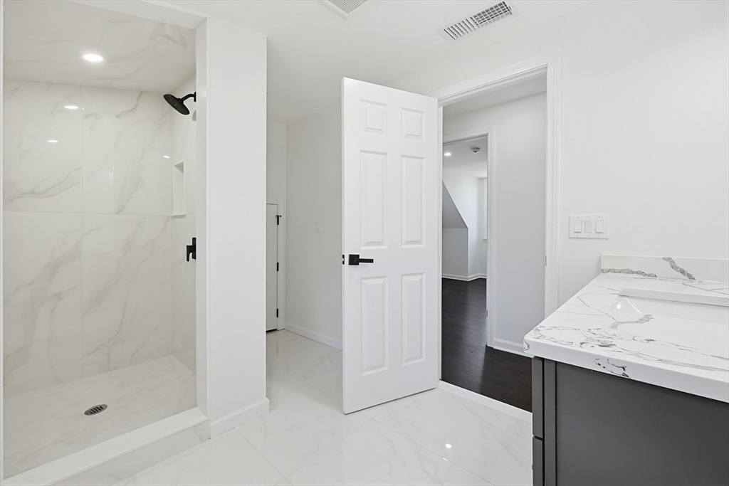 175 Pleasant Street Upton, MA 01568 - Photo 30 of 39 a bathroom with a sink and shower