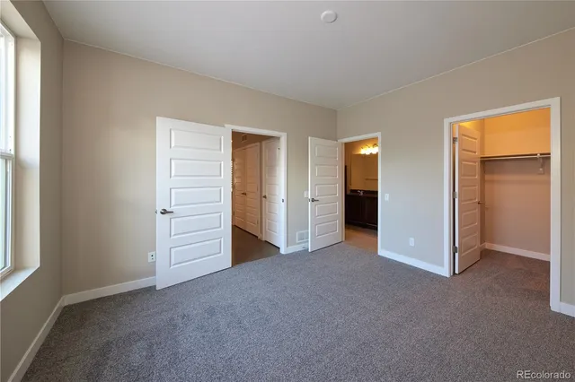 a view of empty room with closet