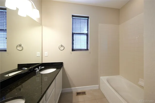 a bathroom with a sink and a bathtub