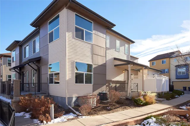 a front view of a house with sitting area
