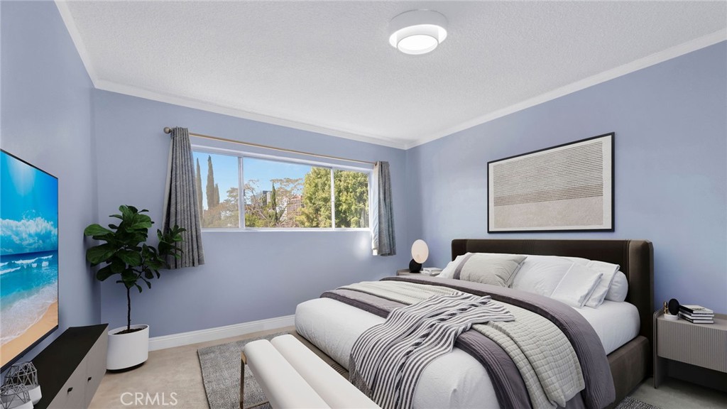10725 Ohio Avenue, Unit 301 Los Angeles, CA 90024 - Photo 19 of 39 a bedroom with a bed and a potted plant