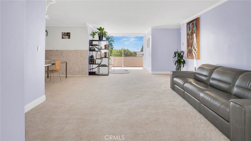 10725 Ohio Avenue, Unit 301 Los Angeles, CA 90024 - Photo 6 of 39 a living room with furniture and a large window