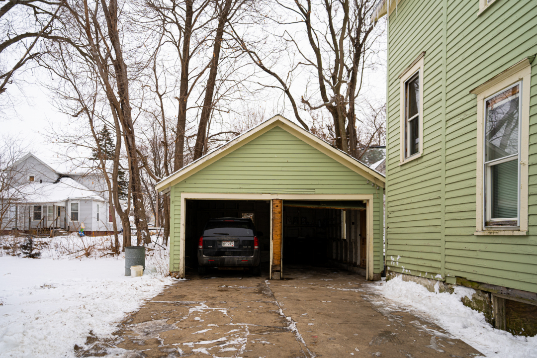 821-823 South Carroll Avenue Freeport, IL 61032 - Photo 9 of 11 a view of a house with a yard covered in snow