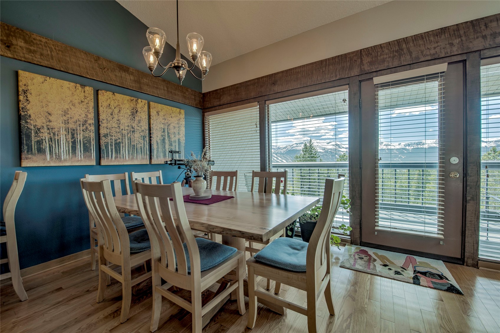 187 Fuller Placer Road, Unit B Breckenridge, CO 80424 - Photo 2 of 33 a view of a dining room with furniture large windows and wooden floor