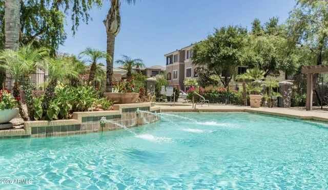 a view of a chair and tables in the garden