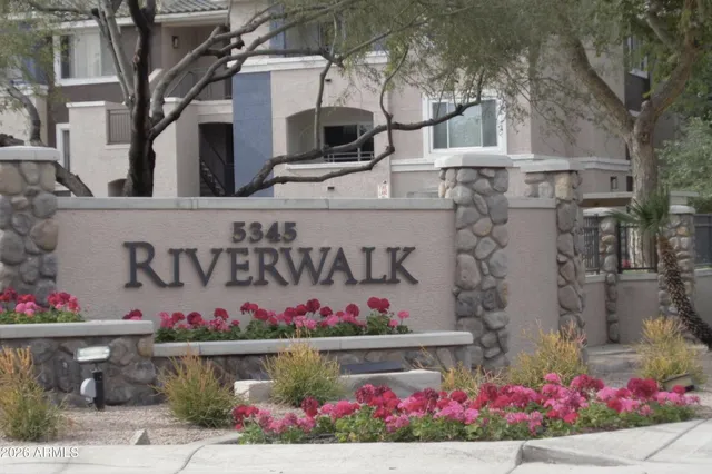 a street sign that is on a wall
