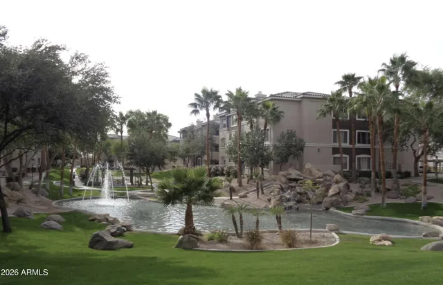 a view of a water fountain in front of the house