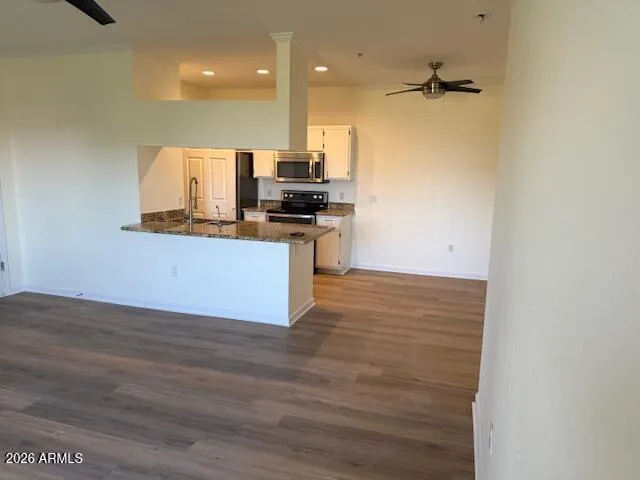 a kitchen with stainless steel appliances a refrigerator and a stove