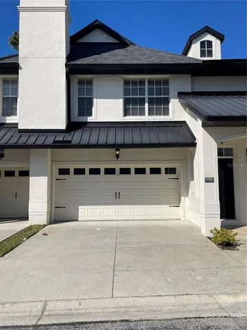 a front view of a house with a garage