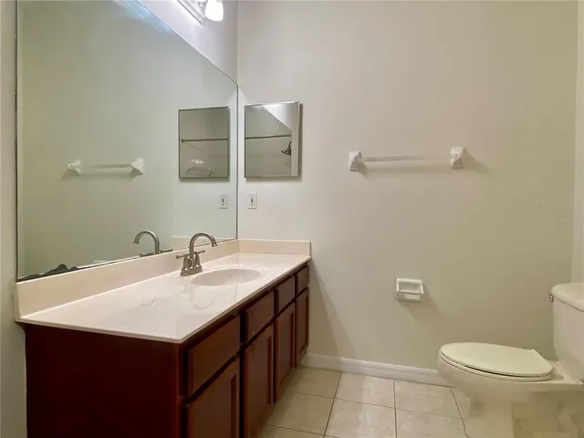 a bathroom with a tub sink double and mirror