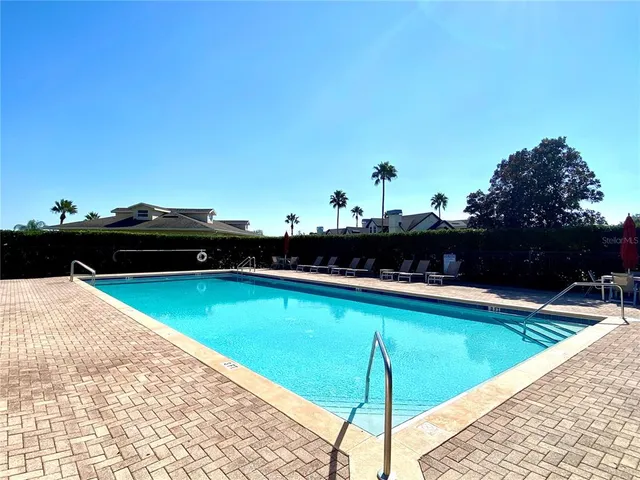 a view of sign board with flower around