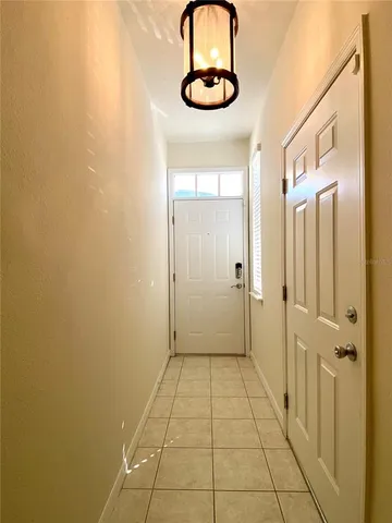 a view of a hallway with stairs