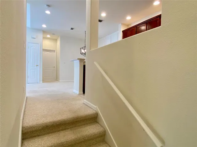 a view of kitchen with refrigerator and window