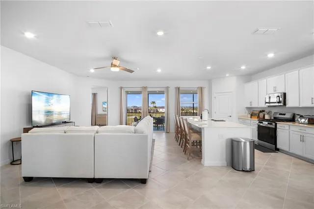 a large white kitchen with lots of counter top space