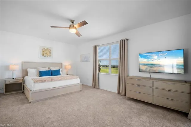 a spacious bedroom with a bed and a window