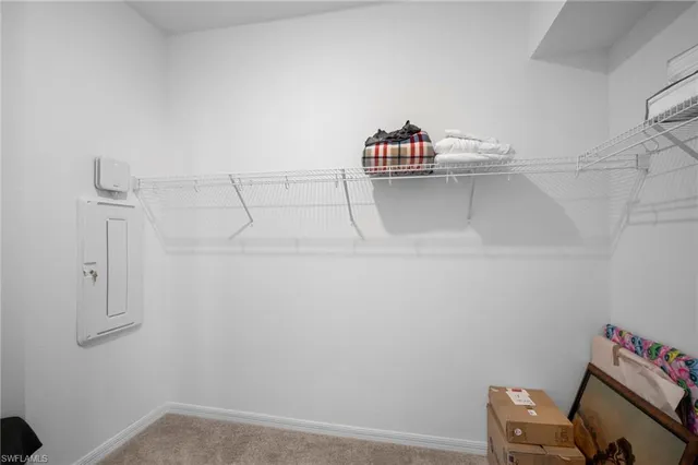 a view of a storage and utility room with empty racks