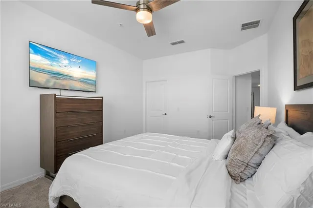 a bedroom with a bed and a dresser