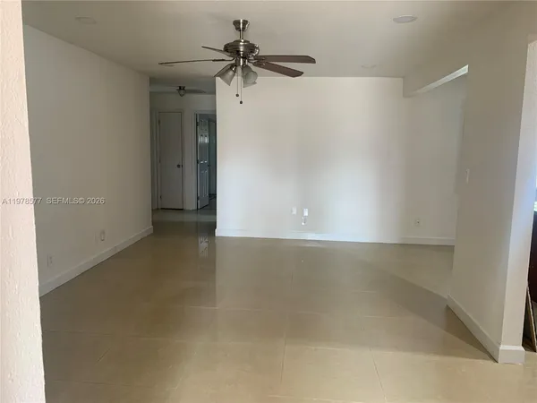 a kitchen with stainless steel appliances granite countertop a refrigerator stove and microwave