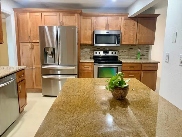 a room with a sink and cabinets