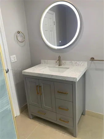 a view of a bathroom with a shower and a tub