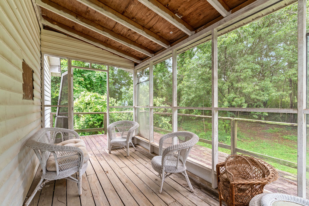 712 Whitney Way Anderson, SC 29625 - Photo 27 of 31 Relax outdoors in this private, screened porch, offering tranquil tree views and comfortable space.
