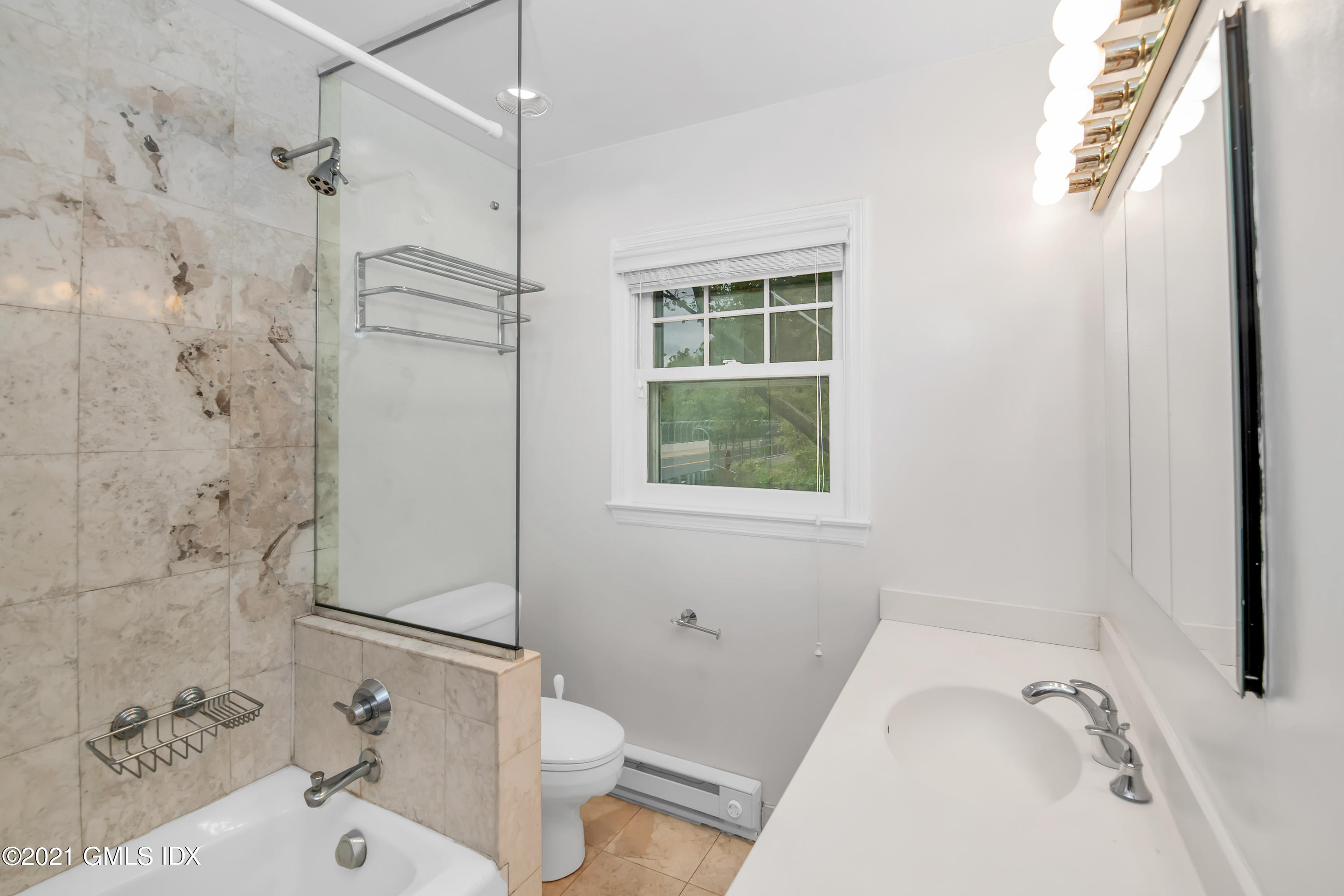 30 Pleasant Street Riverside, CT 06878 - Photo 11 of 19 a bathroom with a sink and a tub