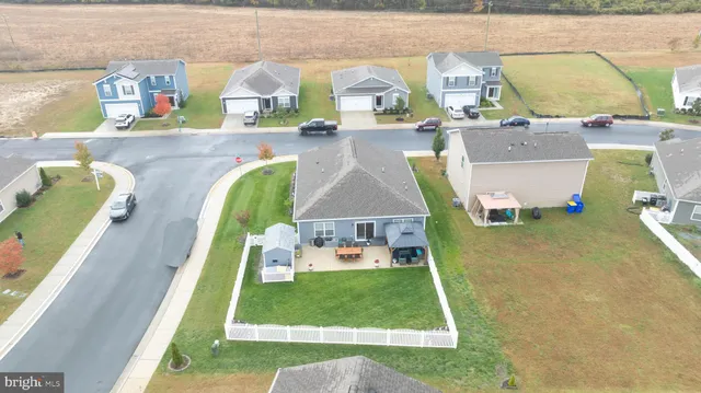 an aerial view of a house with outdoor space