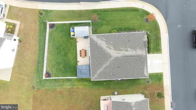an aerial view of a house with a lake view