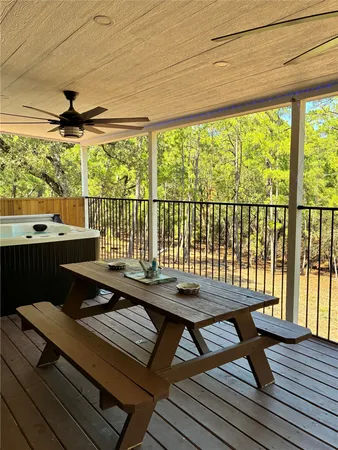 a view of a patio with wooden floor