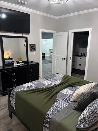 a bedroom with a bed and a dresser