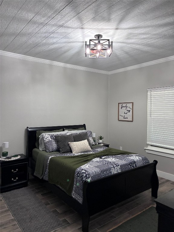 1135 Red Fox Road La Grange, TX 78945 - Photo 18 of 32 a bedroom with a bed and a chandelier