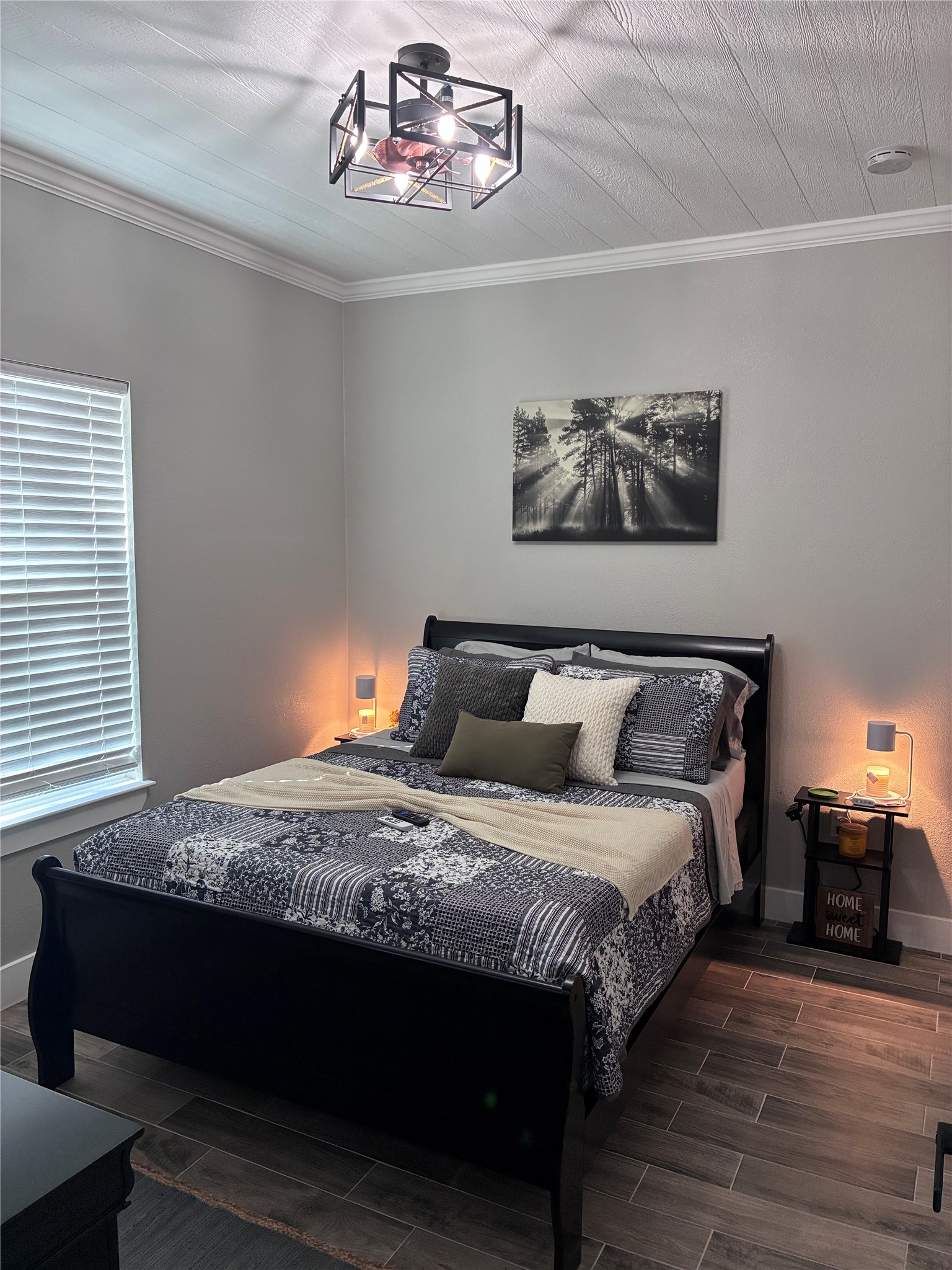 1135 Red Fox Road La Grange, TX 78945 - Photo 25 of 32 a bedroom with bed and wooden floor