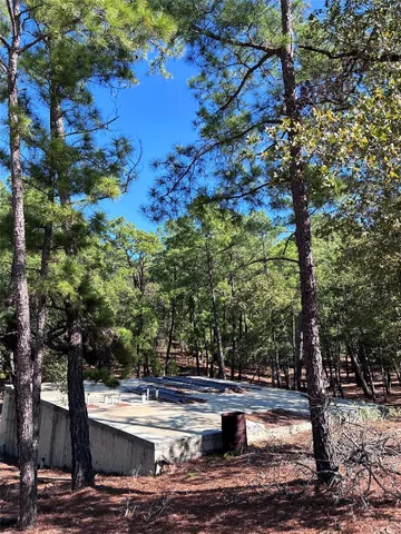 a view of house with backyard