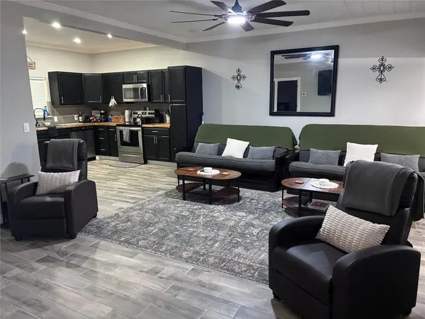 a living room with furniture and a flat screen tv