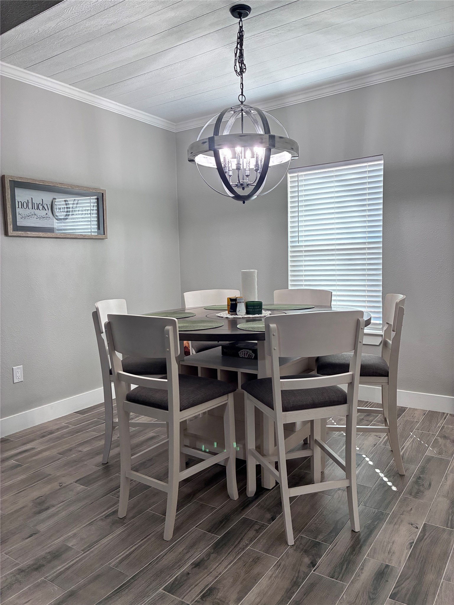1135 Red Fox Road La Grange, TX 78945 - Photo 7 of 32 a view of a dining room with furniture wooden floor and a chandelier