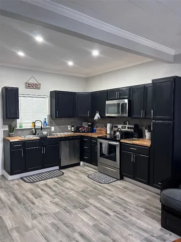 a view of a patio with wooden floor