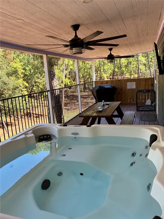 a bedroom with furniture and a large window