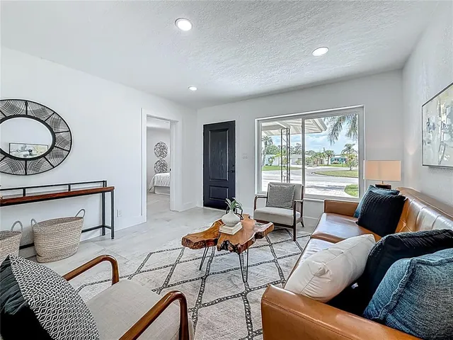 a kitchen with white cabinets and a sink