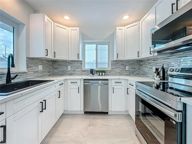 a view of a dining room with furniture and window