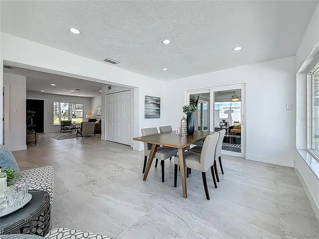 a bathroom with a sink vanity granite and a mirror
