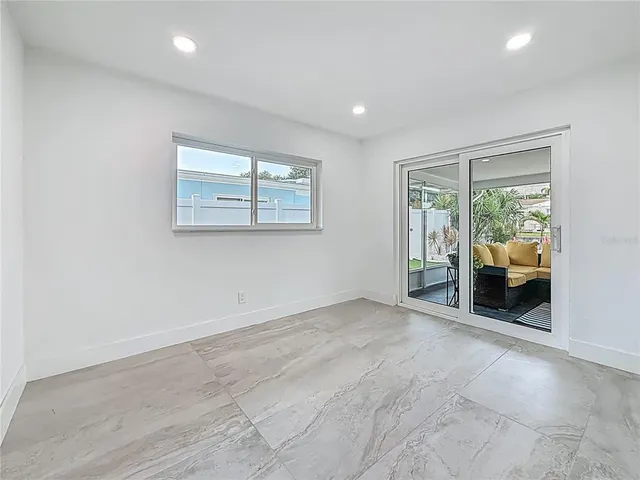 a bathroom with a toilet sink vanity and mirror