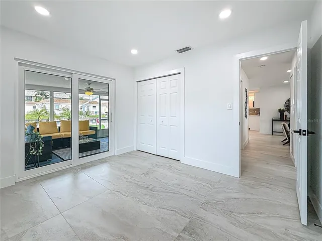 a en suite bathroom with a granite countertop sink and a mirror