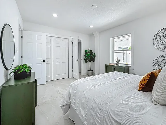 a view of a house with a swimming pool and a yard
