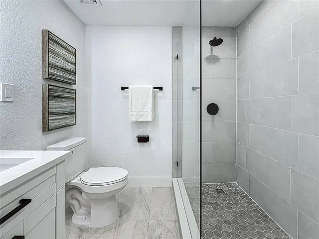 a view of a house with swimming pool and sitting area