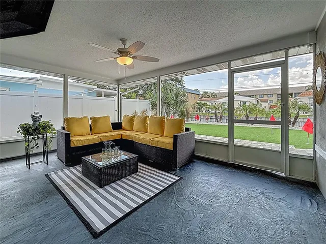 a view of a house with swimming pool and sitting area